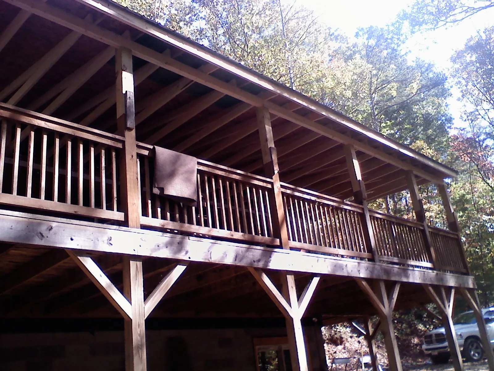 Timber framing under a new elevated porch and deck — Roof Leak Repair in Royal Center by Roofing Brothers